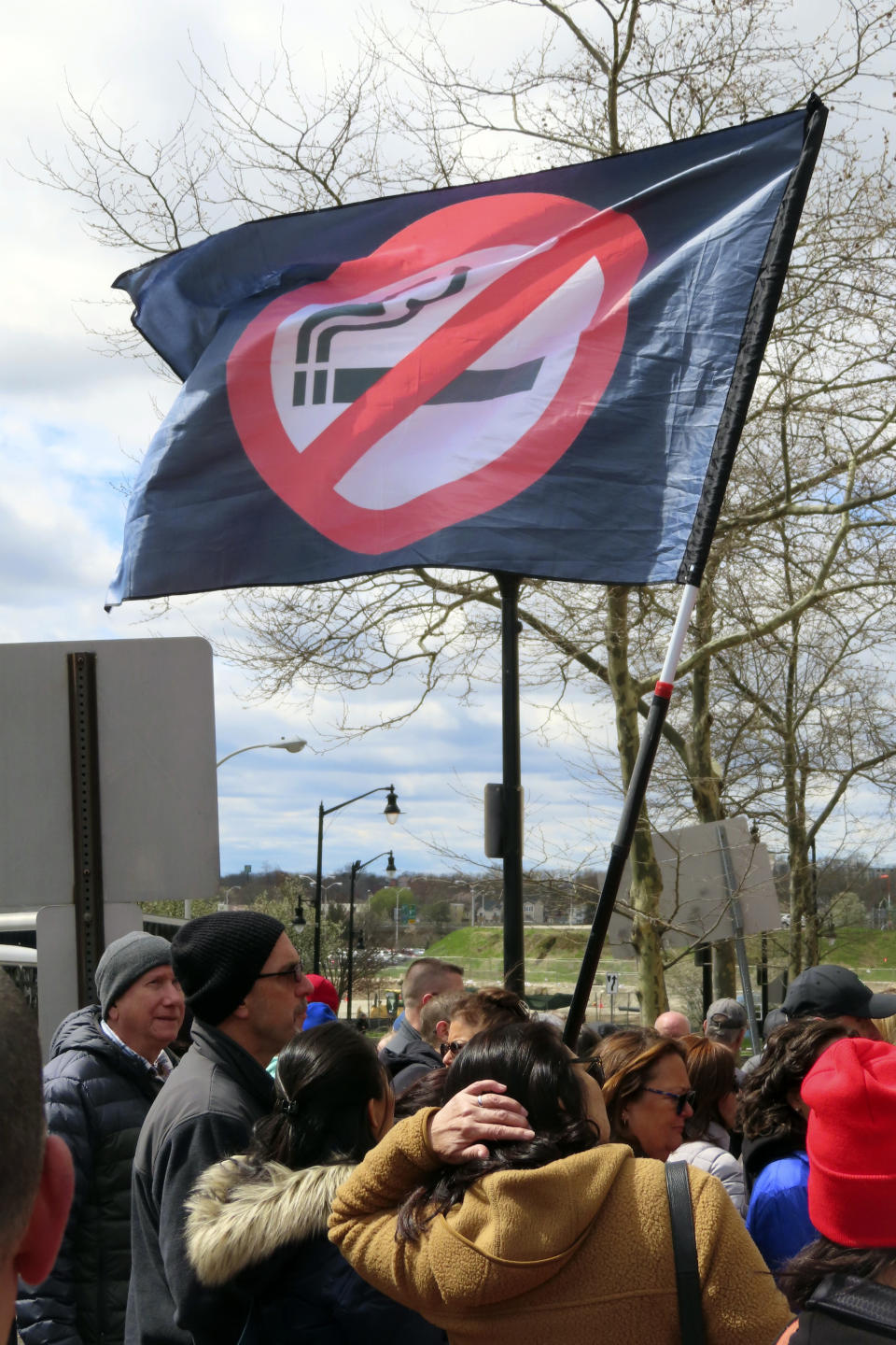 Atlantic City casino workers fly an anti-smoking flag during a rally in Trenton, N.J., on April 5, 2024, after the United Auto Workers and casino workers filed a lawsuit challenging New Jersey's clean indoor air law that exempts casino workers from its protections. (AP Photo/Wayne Parry)