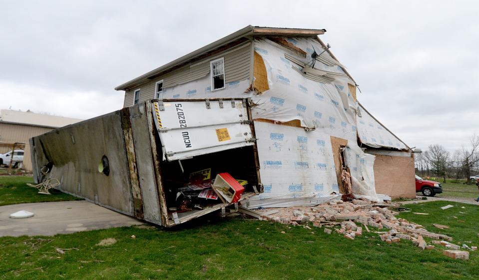 The home where Brenda Brooks and her 96-year-old mother rode out the tornado in their bathroom on West Outer Road in Sherman was stuck by this storage container during the storm.