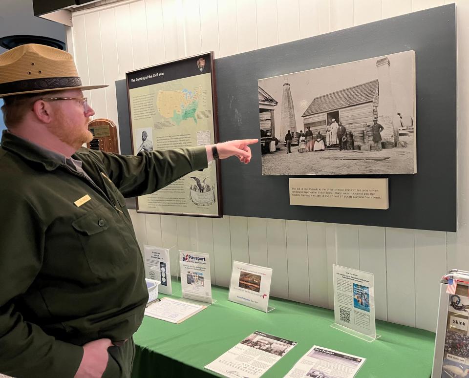 Ranger Max Farley points out a display about slavery and Fort Pulaski’s connection to the Underground Railroad.