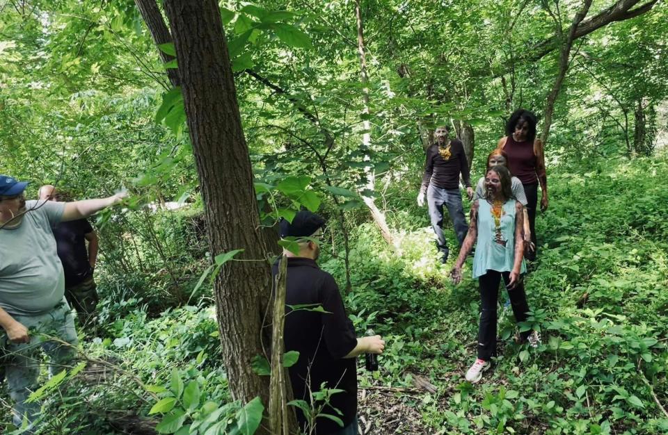 Film director Joshua Maley, back to the camera, shoots a scene for his indie zombie movie involving actress Jamie Krashna (fresh off the set of Paramount+'s "Mayor of Kingstown," where she played a cop.