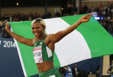 Blessing Okagbare of Nigeria celebrates first place in the Women's News  Photo - Getty Images