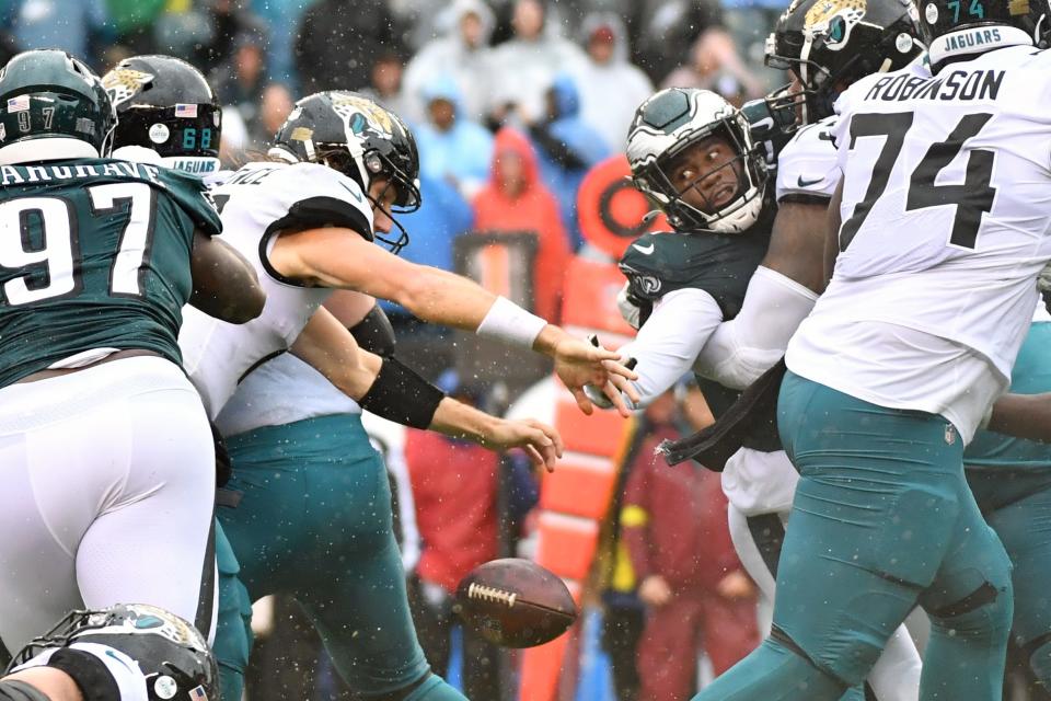 Oct 2, 2022; Philadelphia, Pennsylvania, USA;  Philadelphia Eagles linebacker Haason Reddick (7) strips the football from Jacksonville Jaguars quarterback Trevor Lawrence (16) during the fourth quarter at Lincoln Financial Field. Mandatory Credit: Eric Hartline-USA TODAY Sports