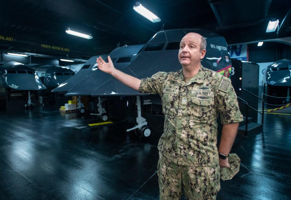 Capt. Kinsella gives a tour of the simulators at the National Flight Academy aboard NAS Pensacola on Monday, June 21, 2021.  The academy will be a host for one of the Department of Defense's STARBASE Youth Program locations.