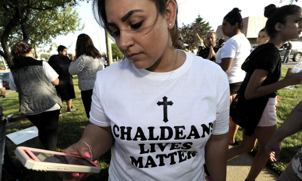 A protester demonstrates against the arrest of dozens of Iraqi Christians in south-eastern Michigan by US immigration officials.