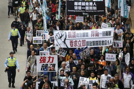 Demonstrators march during a protest over the disappearance of booksellers, in Hong Kong, China January 10, 2016. REUTERS/Tyrone Siu