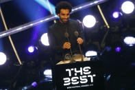 Egypt's soccer star Mohamed Salah receives the FIFA Puskas award during the ceremony of the Best FIFA Football Awards in the Royal Festival Hall in London, Britain, Monday, Sept. 24, 2018. (AP Photo/Frank Augstein)