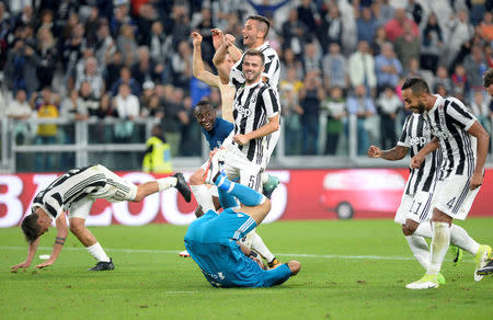 FILE PHOTO: Soccer Football - Serie A - Juventus vs Torino - Juventus Stadium, Turin, Italy - September 23, 2017 Juventus’ Gianluigi Buffon, Paulo Dybala, Miralem Pjanic and team mates celebrate at the end of the match REUTERS/Massimo Pinca