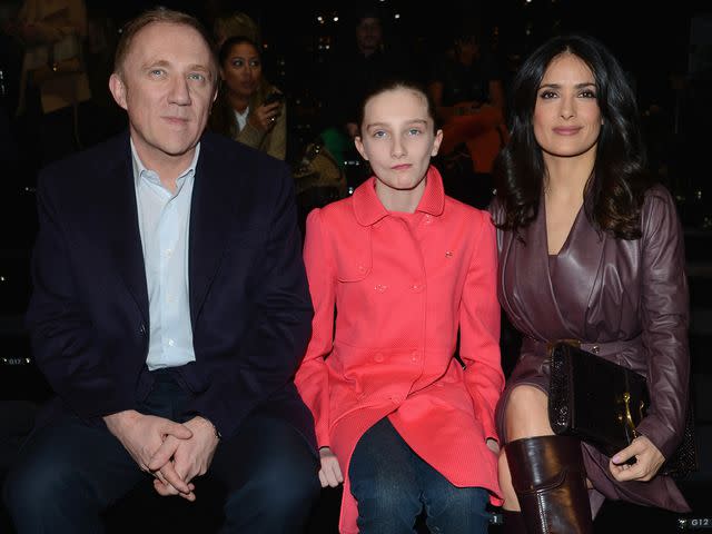 <p>Venturelli/Getty</p> Francois-Henri Pinault, Mathilde Pinault and Salma Hayek at the Gucci fashion show during Milan Fashion Week Fall/Winter in February 2013 in Milan, Italy.