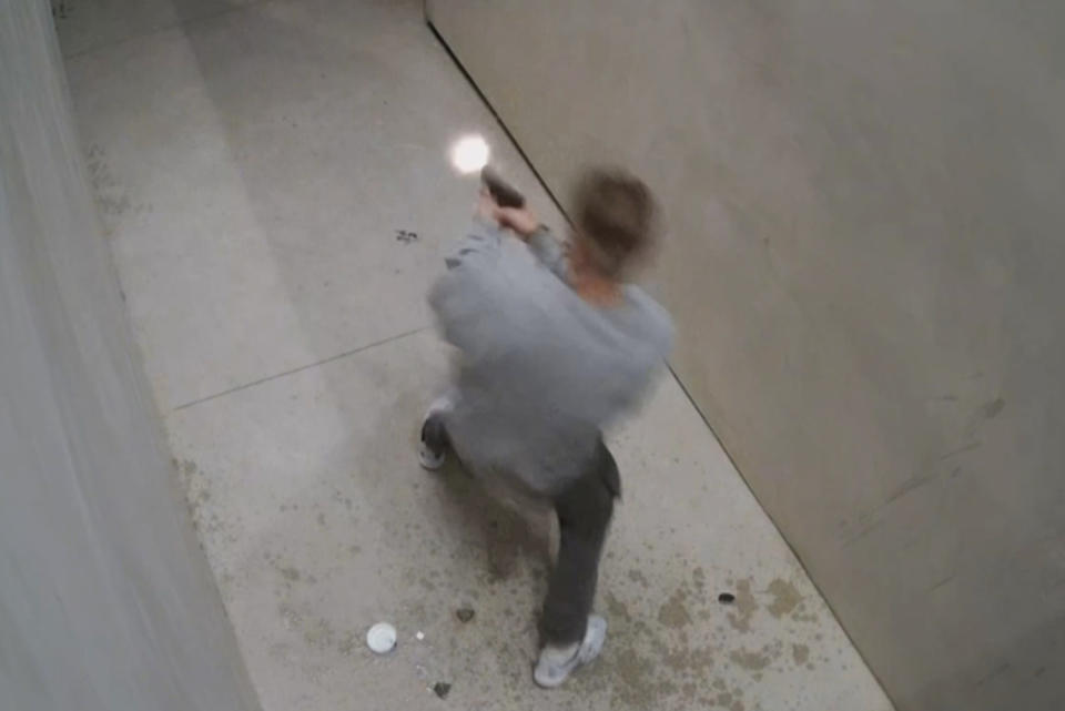 The homeowner shoots at the retreating attackers with his weapon. (Homeowner's surveillance camera)