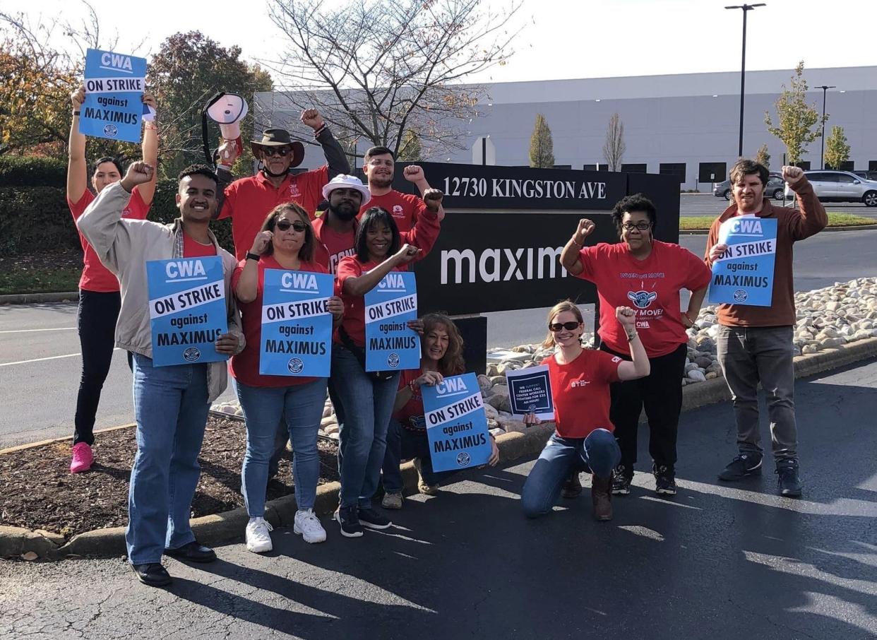 Chester Maximus call center workers and supporters strike poses while picketing on November 9.
