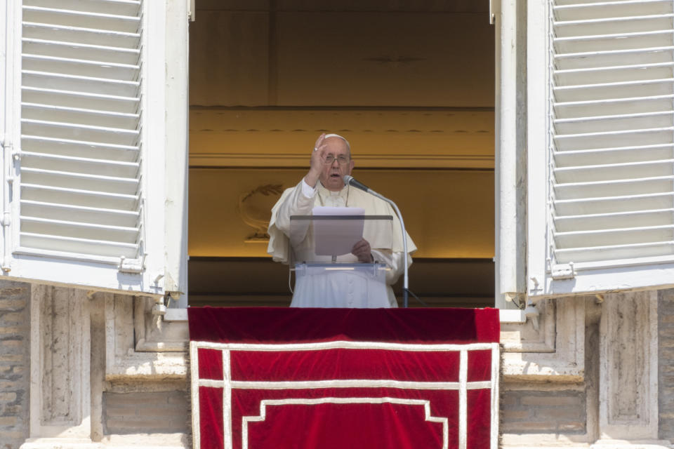 Pope Francis delivers his blessing as he recites the Regina Coeli noon prayer from the window of his studio overlooking St.Peter's Square, at the Vatican, Sunday, May 22, 2022. (AP Photo/Andrew Medichini)