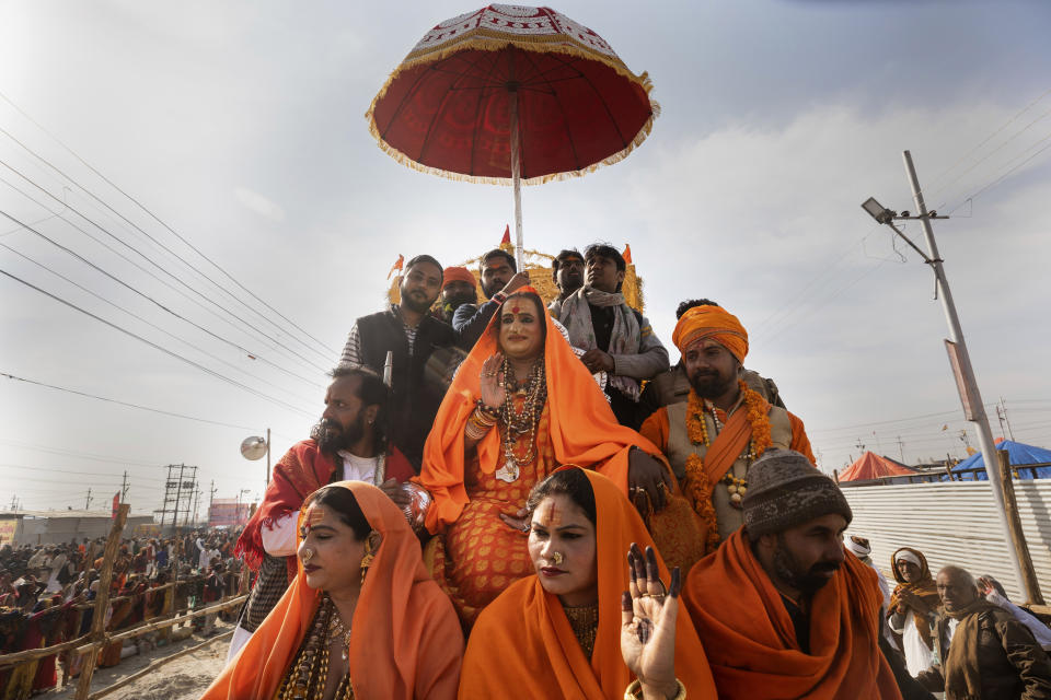 In this Jan. 15, 2019, photo, Laxmi Narayan Tripathi, an Indian transgender activist and leader of the "Kinnar akhara" monastic order, participates in a procession during the Kumbh Mela festival in Allahabad, India. Kinnars celebrated their inclusion at Kumbh as a victory, but their greater acceptance by Hinduism’s most powerful leaders, in the religious and political spheres, remains to be seen. Unlike other akharas, which are only open to Hindu men, Kinnar, founded in 2015, is open to all genders and religions. (AP Photo/Bernat Armangue)