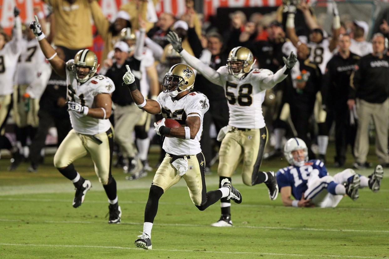 Tracy Porter #22 of the New Orleans Saints intercepts a ball and thrown by Peyton Manning #18 of the Indianapolis Colts and returns it for a touchdown in the fourth quarter during Super Bowl XLIV on February 7, 2010