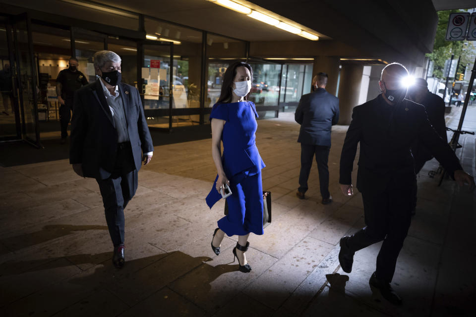 Meng Wanzhou, chief financial officer of Huawei, leaves the British Columbia Supreme Court during a break from her extradition hearing, in Vancouver, on Monday, Aug. 16, 2021. (Darryl Dyck/The Canadian Press via AP)