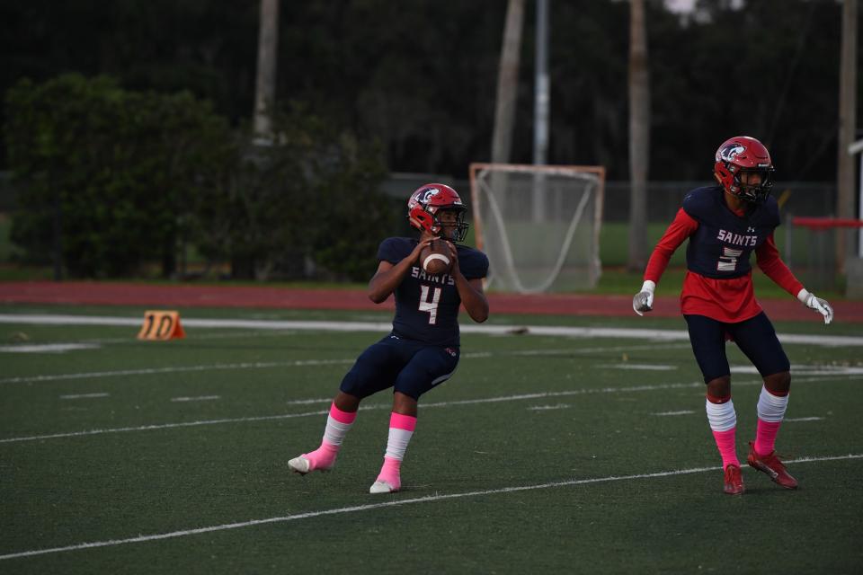 All Saints quarterback Daunte Giles gears up for a pass vs. Master's Class.