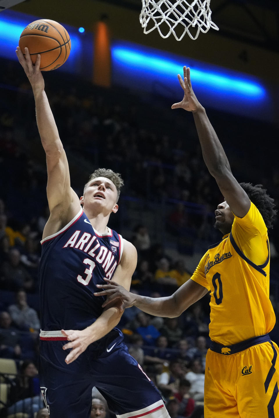 Arizona guard Pelle Larsson, left, shoots next to California guard Marsalis Roberson during the second half of an NCAA college basketball game in Berkeley, Calif., Thursday, Feb. 9, 2023. (AP Photo/Godofredo A. Vásquez)