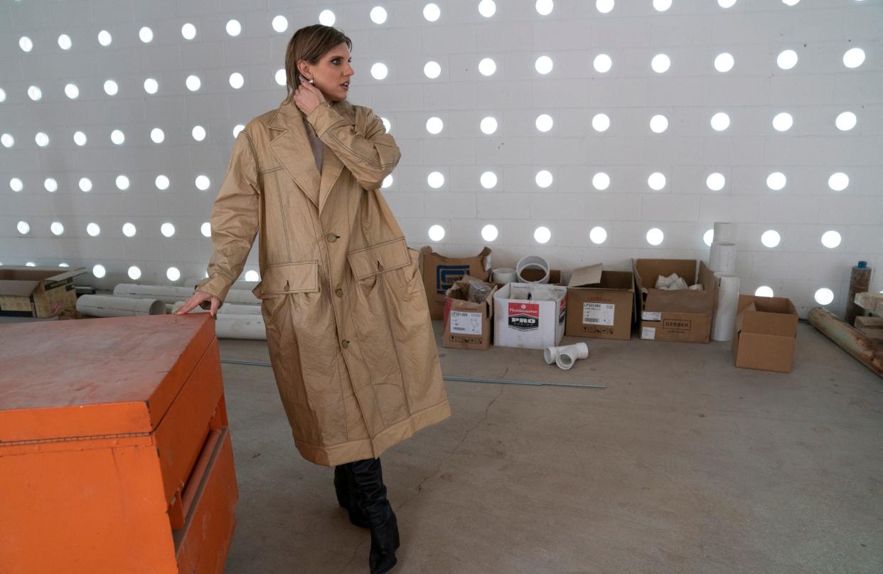 Angela Wisniewski-Cobbina checks out her new retail space at the Lantern for her store Coup D'état on Tuesday, March 26, 2024. Wisniewski-Cobbina is in the process of moving her store from New Center to the Lantern on Kercheval in Detroit.