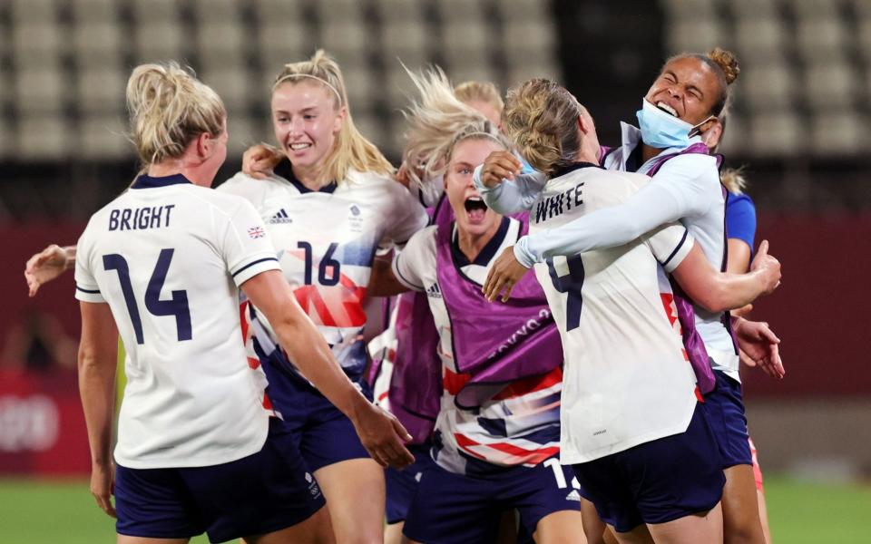 Ellen White goes wild with her team-mates after making it 2-1 to Great Britain - REUTERS