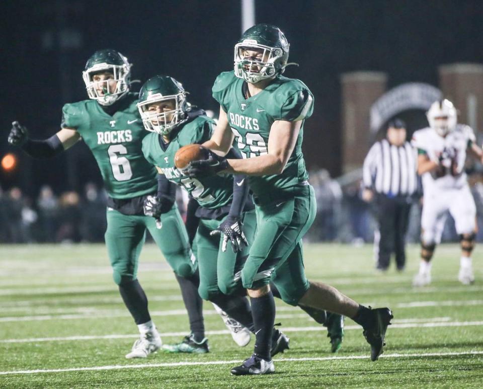 Trinity’s Brady McEnaney celebrates his interception late in the second half against Frederick Douglass in the Class 6A state finals.