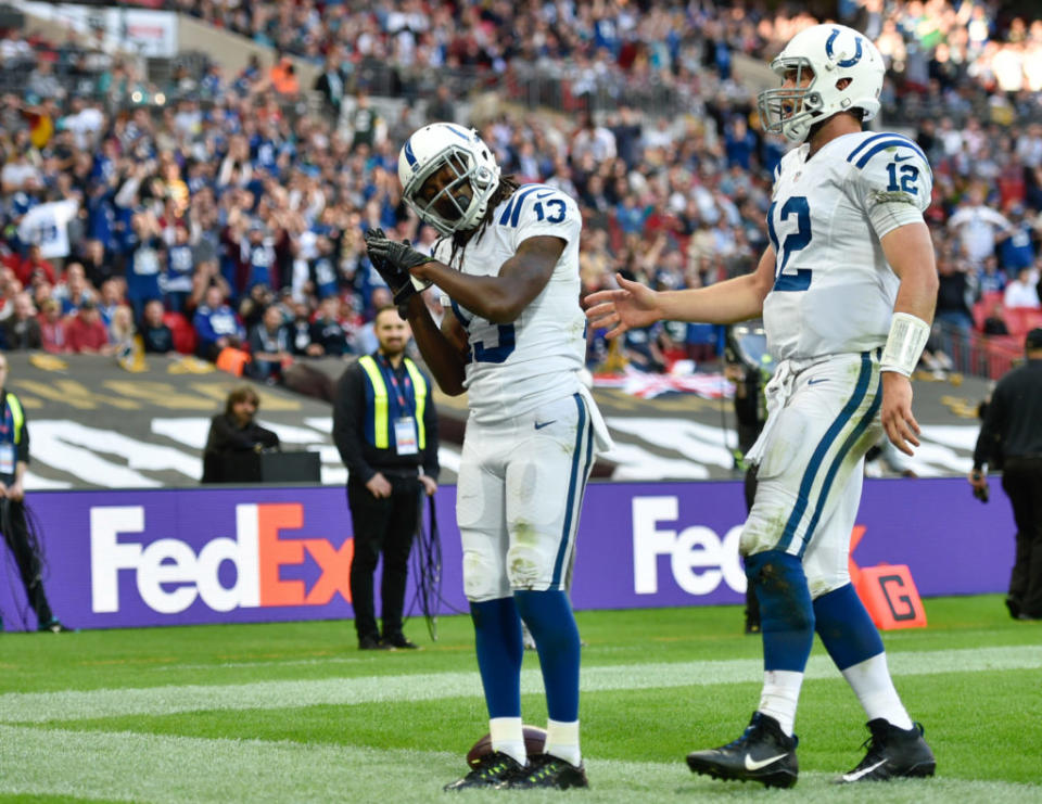 Oct 2, 2016; London, United Kingdom; T.Y. Hilton (13) of the Indianapolis Colts celebrates a two yard touchdown with quarterback Andrew Luck (12) during the fourth quarter against the Jacksonville Jaguars at Wembley Stadium. Mandatory Credit: Steve Flynn-USA TODAY Sports