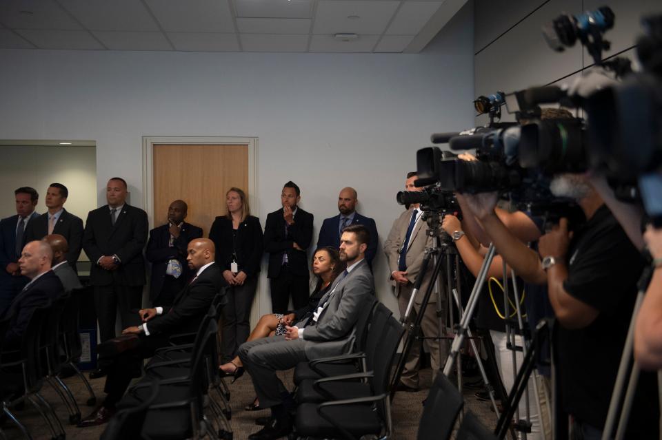 Employees from the prosecutor's office and law enforcement officials line the room as a press briefing is held announcing charges in the kidnapping and murder of Curtis Jenkins III in Camden, N.J. on Wednesday, July 3, 2019.