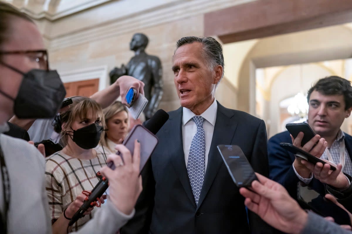 File Mitt Romney, R-Utah, is surrounded by reporters as he arrives at the historic Old Senate Chamber at the Capitol in Washington (AP)