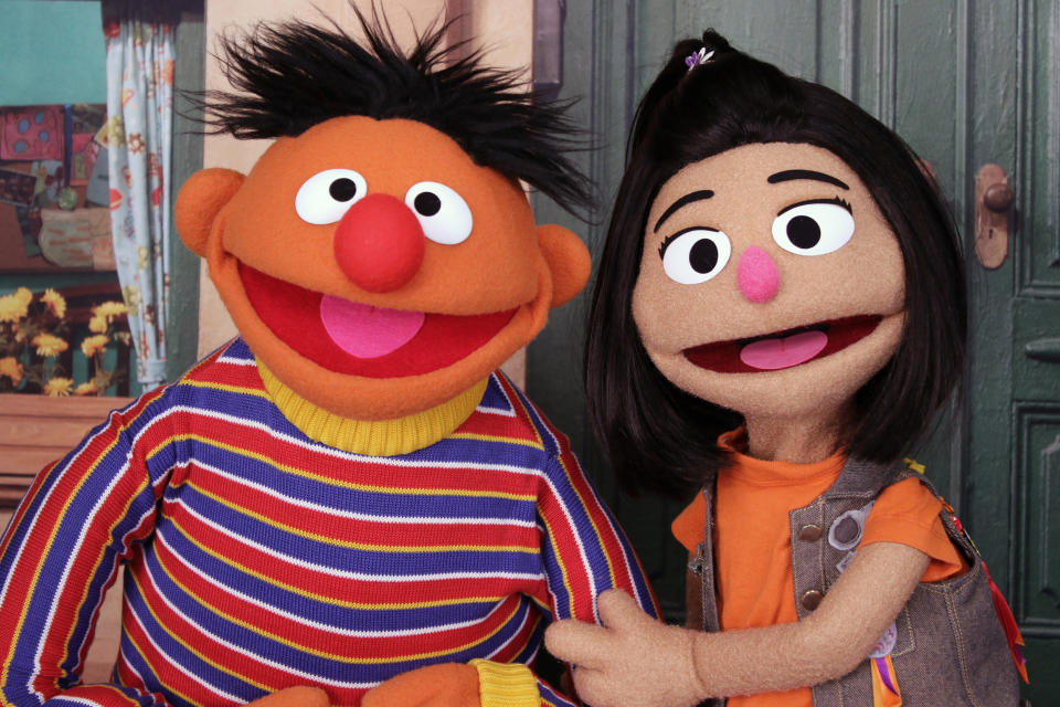 Ernie appears with Ji-Young, the first Asian American muppet on 