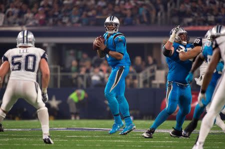 Nov 26, 2015; Arlington, TX, USA; Carolina Panthers quarterback Cam Newton (1) drops back to pass against the Dallas Cowboys during the second half of an NFL game on Thanksgiving at AT&T Stadium. The Panthers defeat the Cowboys 33-14. Mandatory Credit: Jerome Miron-USA TODAY Sports