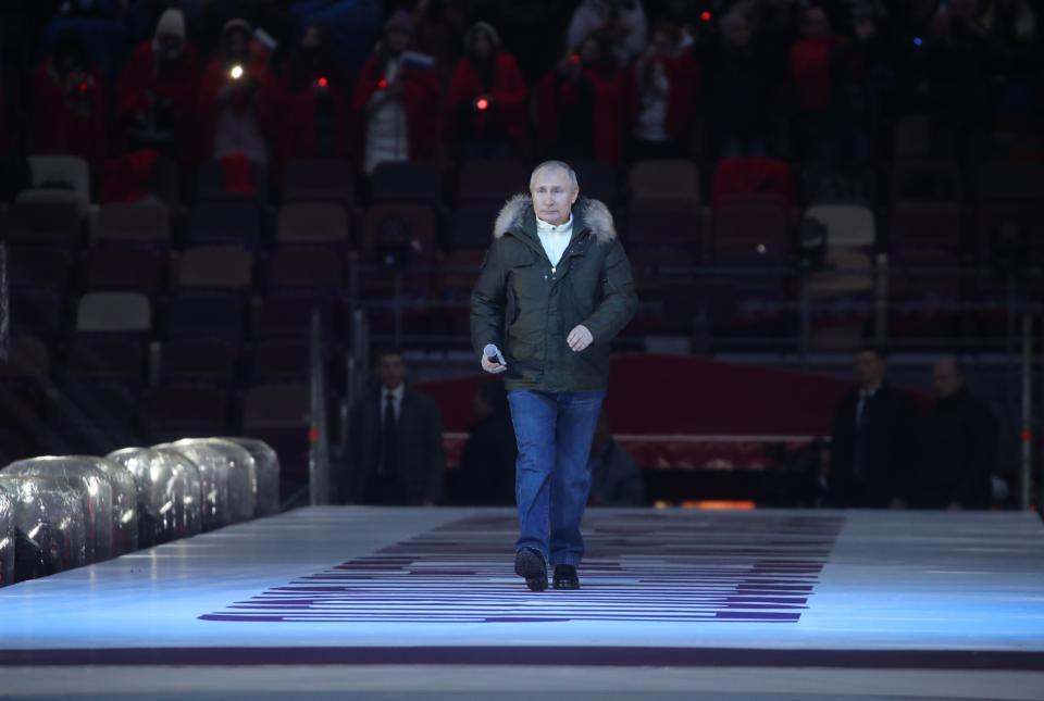 Russian President Vladimir Putin arrives to attend a concert marking the seventh anniversary of the referendum on the state status of Crimea and Sevastopol and its reunification with Russia, in Moscow, Russia, Thursday, March 18, 2021. (Vyacheslav Prokofyev, Sputnik, Kremlin Pool Photo via AP)