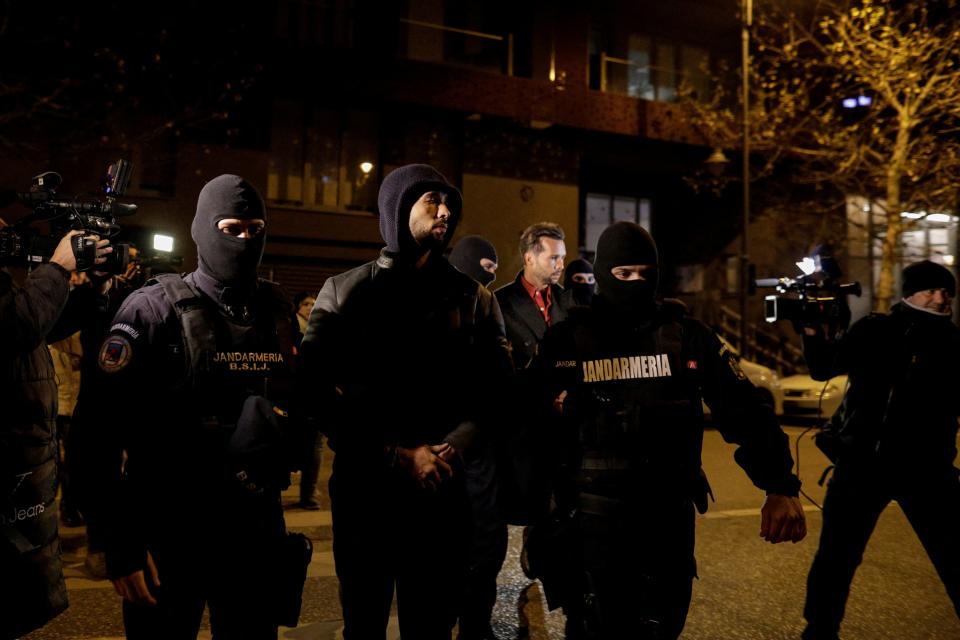 Andrew Tate was led away by Romanian police alongside his brother Tristan (REUTERS)