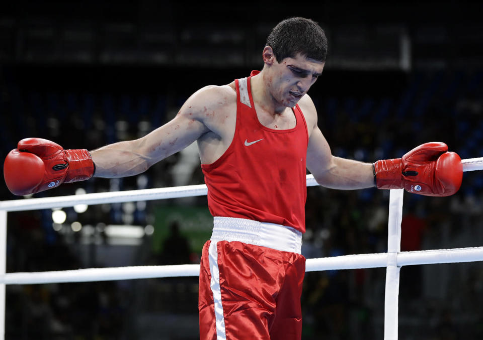 <p>Armenia’s Vladimir Margaryan reacts after losing to Cuba’s Roniel Iglesias with a technical knockout for injury in the first round during a men’s welterweight 69-kg preliminary boxing match at the 2016 Summer Olympics in Rio de Janeiro, Brazil, Thursday, Aug. 11, 2016. (AP Photo/Frank Franklin II) </p>