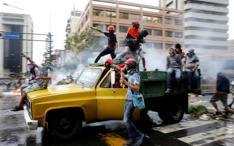 Demonstrators ride on a truck while rallying against Venezuela's President Nicolas Maduro's government in Caracas, Venezuela, June 29, 2017. - Credit: Reuters