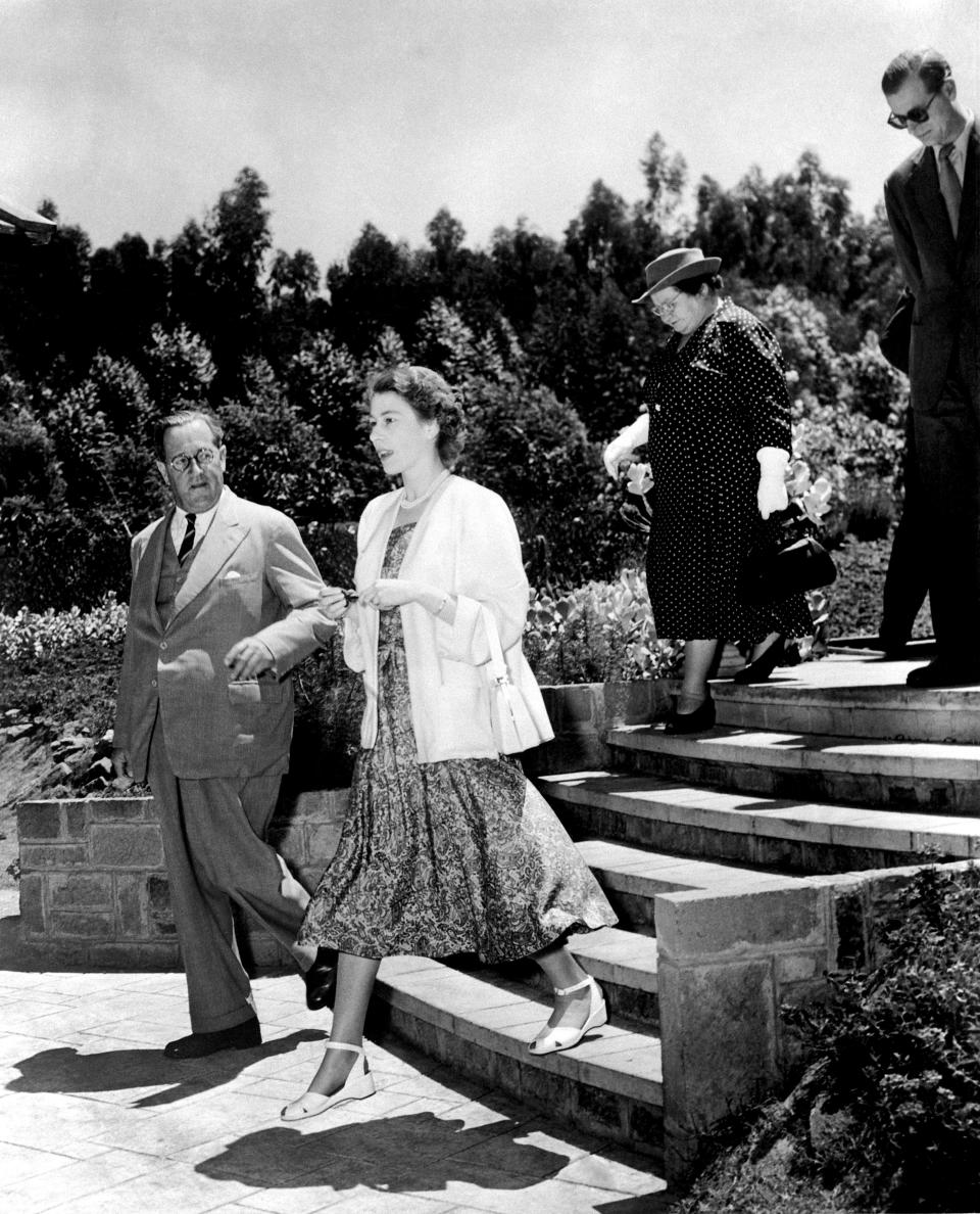 Princess Elizabeth and the Duke of Edinburgh (behind) arrive in Nairobi for their Commonwealth Tour.   (Photo by PA Images via Getty Images)