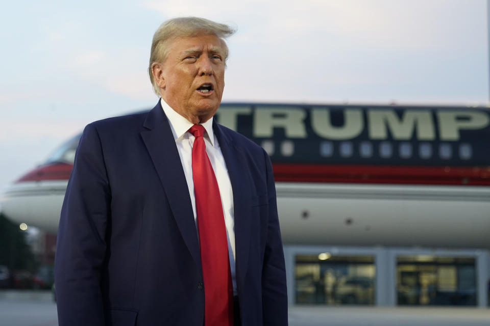 Former President Donald Trump speaks with reporters before departure from Hartsfield-Jackson Atlanta International Airport, Thursday, Aug. 24, 2023, in Atlanta. (AP Photo/Alex Brandon)