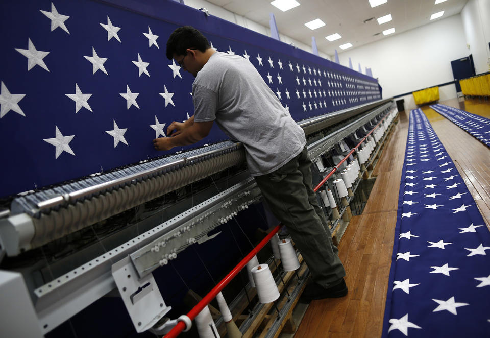 <p>A worker inspects a sheet of stars after embroidery at the FlagSource facility in Batavia, Illinois, U.S., on Tuesday, June 27, 2017. (Photo: Jim Young/Bloomberg via Getty Images) </p>