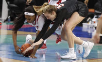 North Carolina State's Jada Boyd (5) and Virginia Tech's Elizabeth Kitley (33) go after a loose ball during the first half of an NCAA college basketball game in the Atlantic Coast Conference women's tournament in Greensboro, N.C., Friday, March 5, 2021. (Ethan Hyman/The News & Observer via AP)