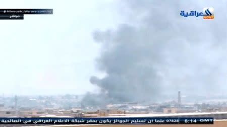 Thick columns of smoke rise from Mosul's Old City district as Iraqi forces seek to expel Islamic State militants from the city, in this still image taken from video, in Mosul, Iraq June 22, 2017. REUTERS TV/via REUTERS