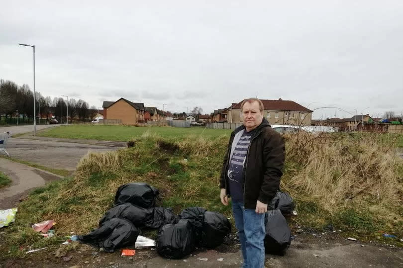 SNP Cllr Kenny MacLaren with rubbish dumped off Candren Road -Credit:Paisley Daily Express