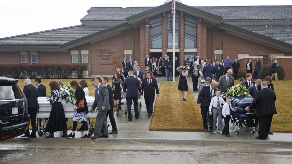 The caskets for Consuelo Alejandra Haynie, daughters 12-year-old Milan and 15-year-old Alexis and 14-year-old son Matthew are carried following their funeral services Friday, Jan. 24, 2020, in Grantsville, Utah. The killing of a Utah mother and three of her children by a gunman identified by police as her 16-year-old son is "nearly unbearable" for the father who survived, a lawyer said Thursday, Jan. 23, 2020.(AP Photo/Rick Bowmer)