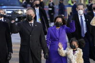 Vice President Kamala Harris, and her husband Doug Emhoff, and family, walk in front of the White House during a Presidential Escort to the White House, Wednesday, Jan. 20, 2021 in Washington, after being sworn in as the 46th vice president of the United States. (AP Photo/Jacquelyn Martin)