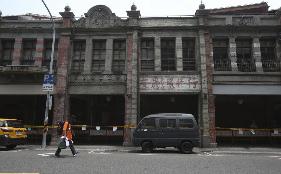 A person wears face mask to protect against the spread of the coronavirus after the COVID-19 alert raise to level 3 in Taipei, Taiwan, Tuesday, May 18, 2021. (AP Photo/Chiang Ying-ying)