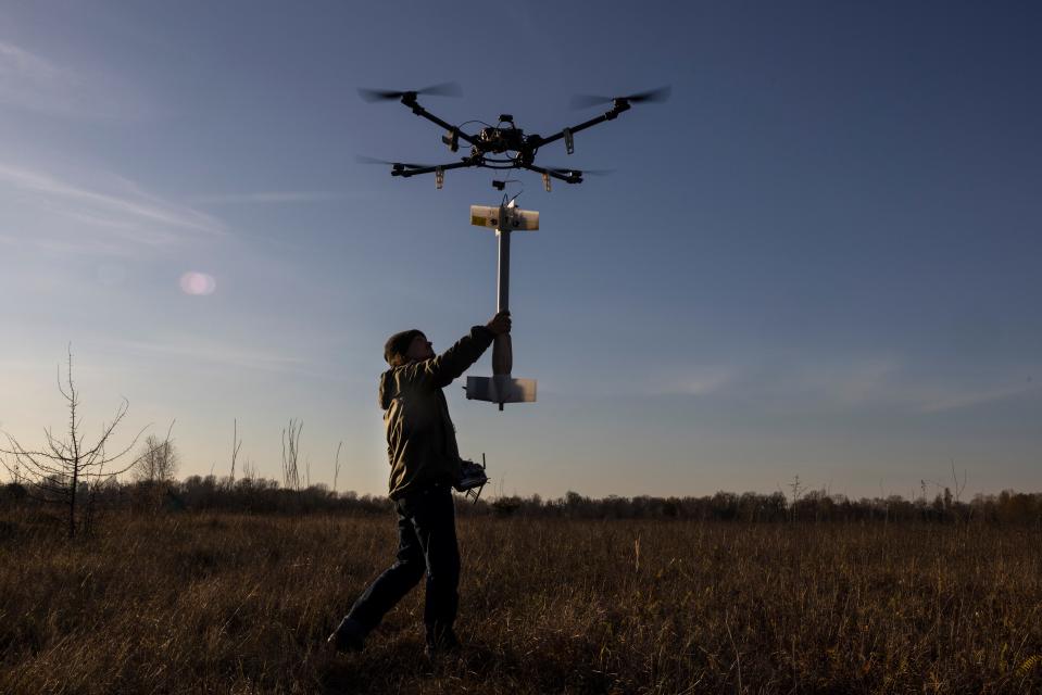 A homemade prototype drone is tested with a fake grenade in a field outside Kyiv in November 2022.