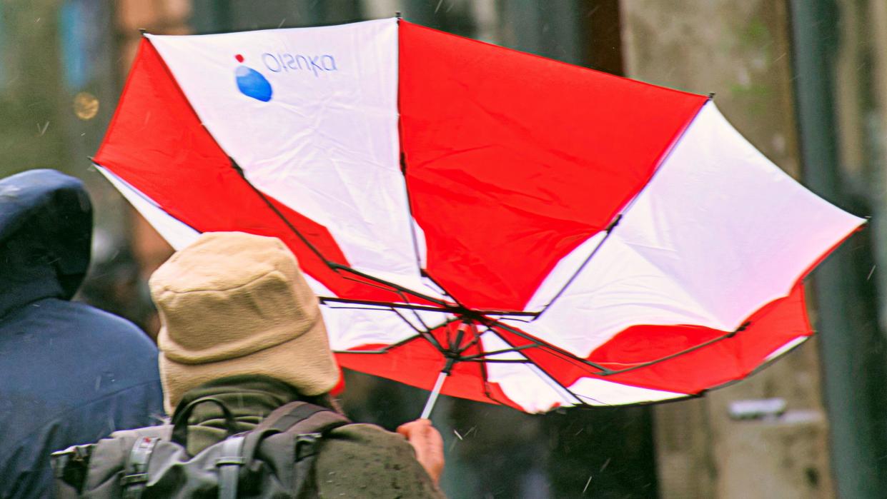 Glasgow, Scotland, UK. 13h April, 2024: UK Weather:  Wet and Windy in the city as people struggled on the shopping capital and style mile of Scotland, Buchanan Street. Credit Gerard Ferry/Alamy Live News