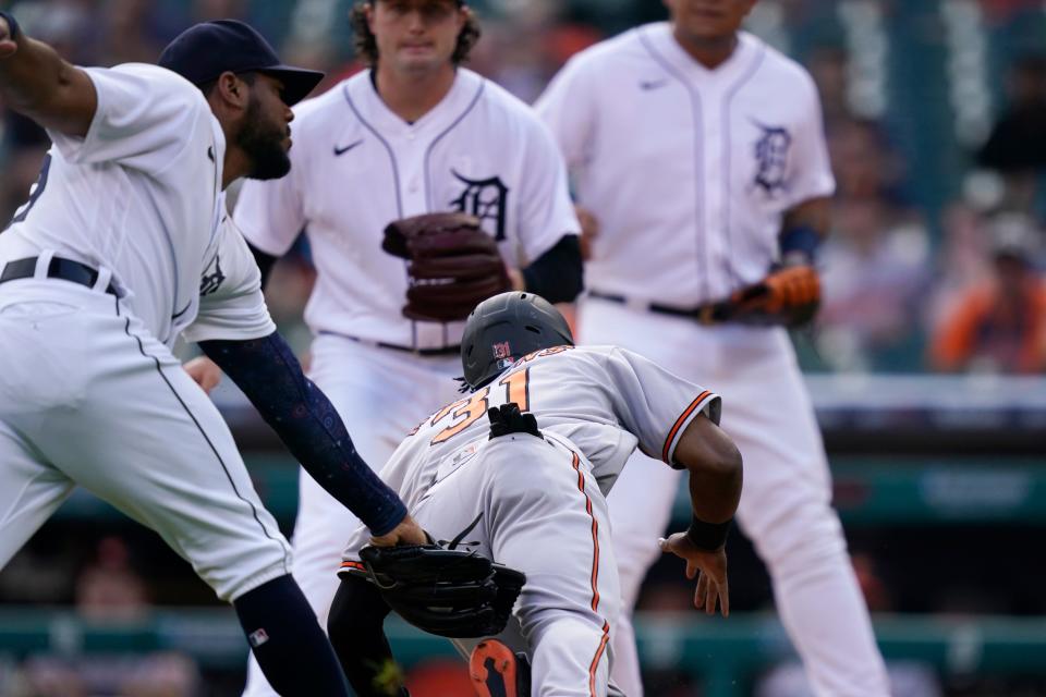 Orioles center fielder Cedric Mullins is tagged out at home by Tigers third baseman Jeimer Candelario during a runddown in the first inning on Thursday, July 29, 2021, at Comerica Park.