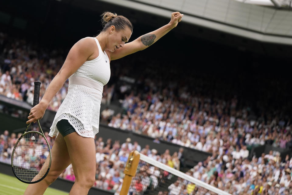 Aryna Sabalenka of Belarus reacts as she wins a point against Tunisia's Ons Jabeur in a women's singles semifinal match on day eleven of the Wimbledon tennis championships in London, Thursday, July 13, 2023. (AP Photo/Alberto Pezzali)
