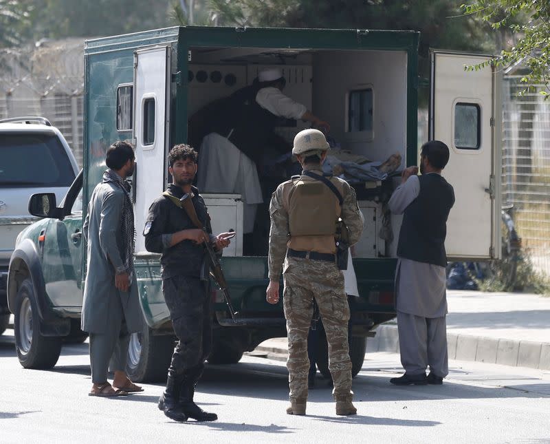 Afghan men carry a victim after a blast in Kabul, Afghanistan September 9, 2020.REUTERS/Mohammad Ismail