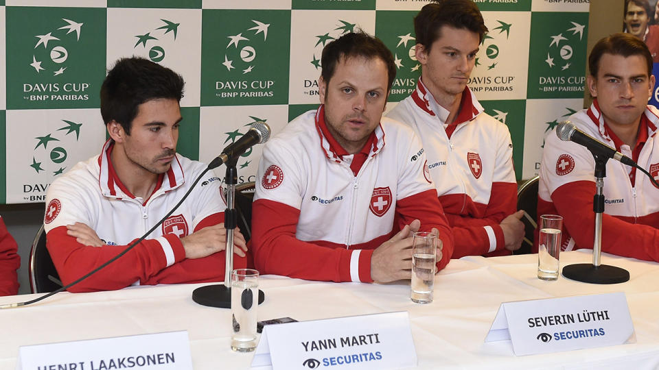 From left: Swiss players Henri Laaksonen, Yann Marti, coach Severin Luthi, Adrien Bossel and Michael Lammer give a press conference on March 3, 2015 ahead of the March 6-8 Davis Cup first round World Group meeting between Belgium and Switzerland in Liege. AFP PHOTO / BELGA / JOHN THYS – BELGIUM OUT – (Photo credit should read JOHN THYS/AFP/Getty Images)