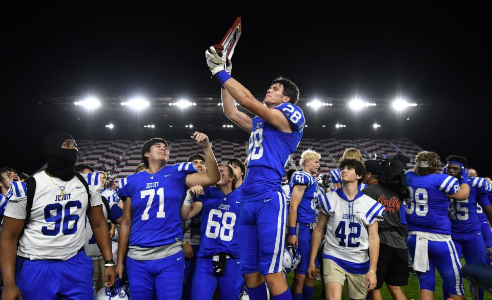 Jesuit (Tampa) celebrates winning the Class 6A state championship game over Pine Forest (Pensacola) at DRV PNK Stadium, Fort Lauderdale, FL  Dec. 17, 2021. 