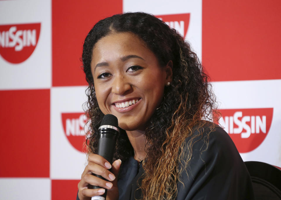 In this Thursday, Sept. 13, 2018, file photo, Naomi Osaka, the champion of U.S. Open women's singles, smiles during a press conference in Yokohama. Osaka defeated Serena Williams of the U.S. on Saturday, Sept. 8, to become the first Grand Slam singles champion from Japan. (AP Photo/Koji Sasahara, FIle)