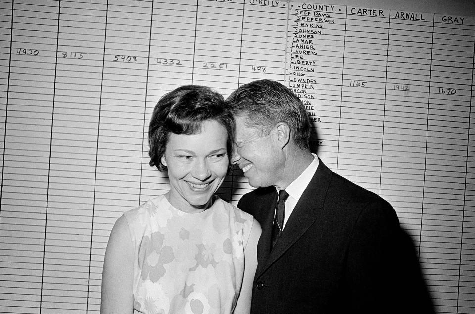 Georgia State Sen. Jimmy Carter hugs his wife, Rosalynn, at his Atlanta campaign headquarters on Sept. 15, 1966. 